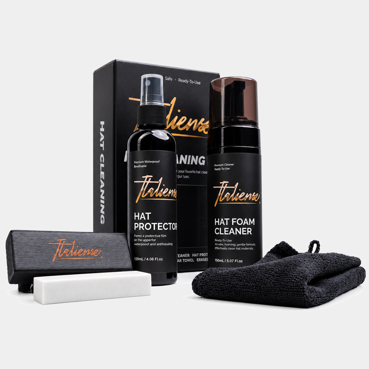 Italiense hat cleaning kit with foam cleaner, protector spray, brush, eraser and microfiber towel on a light gray background